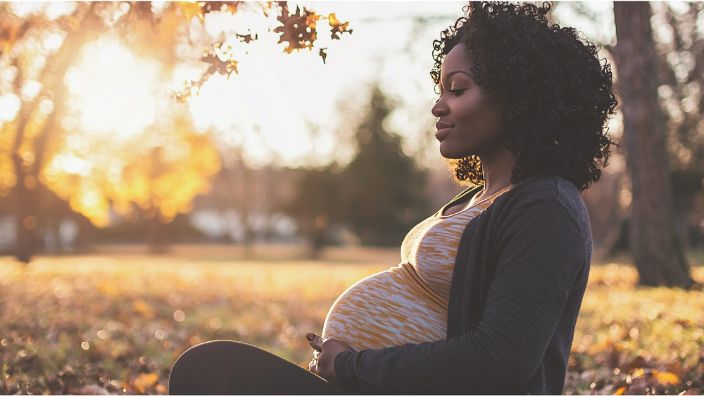 A pregnant woman reflecting in a park